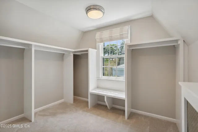 a view of room with window and a ceiling fan