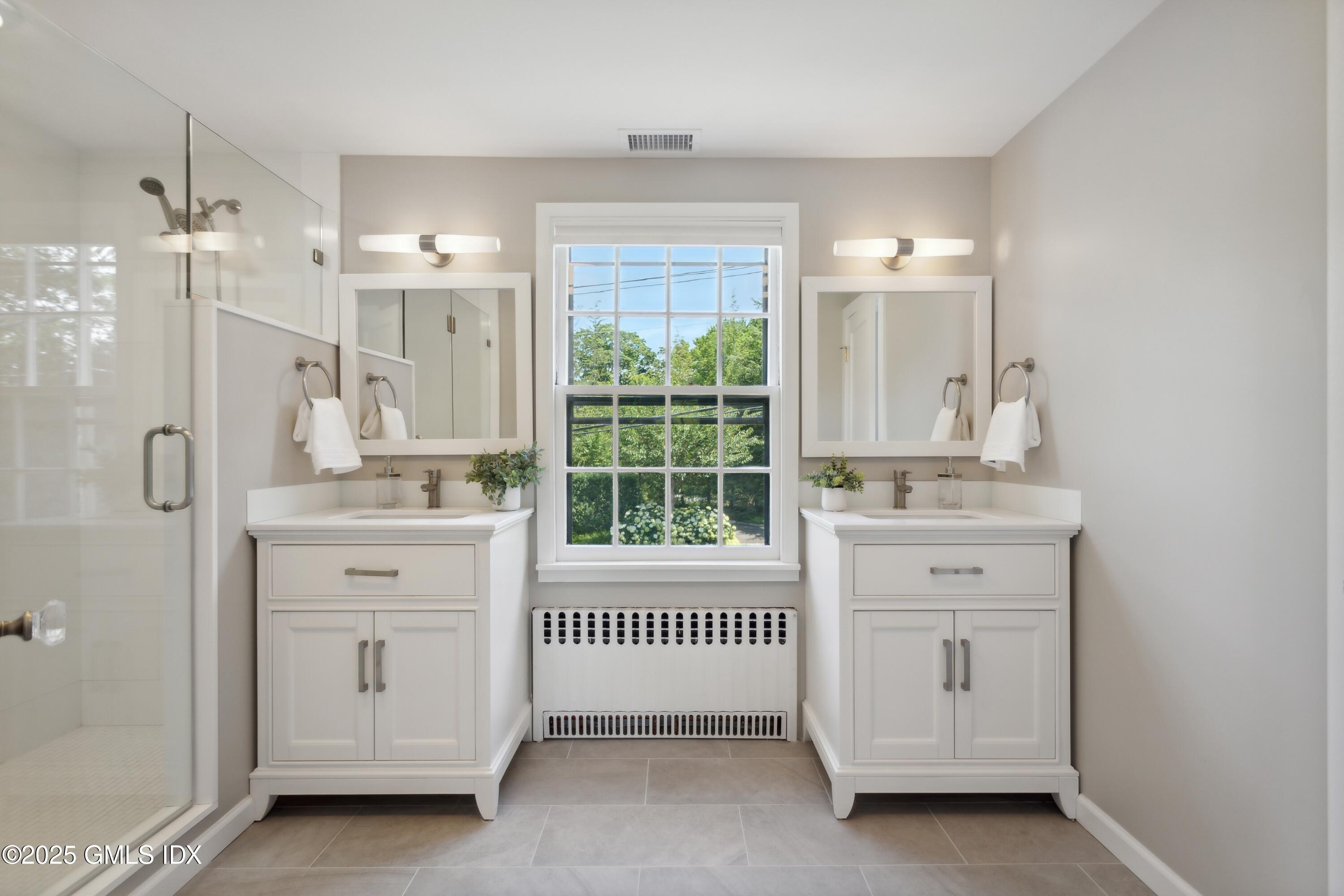 106 Patterson Avenue Greenwich, CT 06830 - Photo 12 of 25 a bathroom with a balcony a sink tub and a window