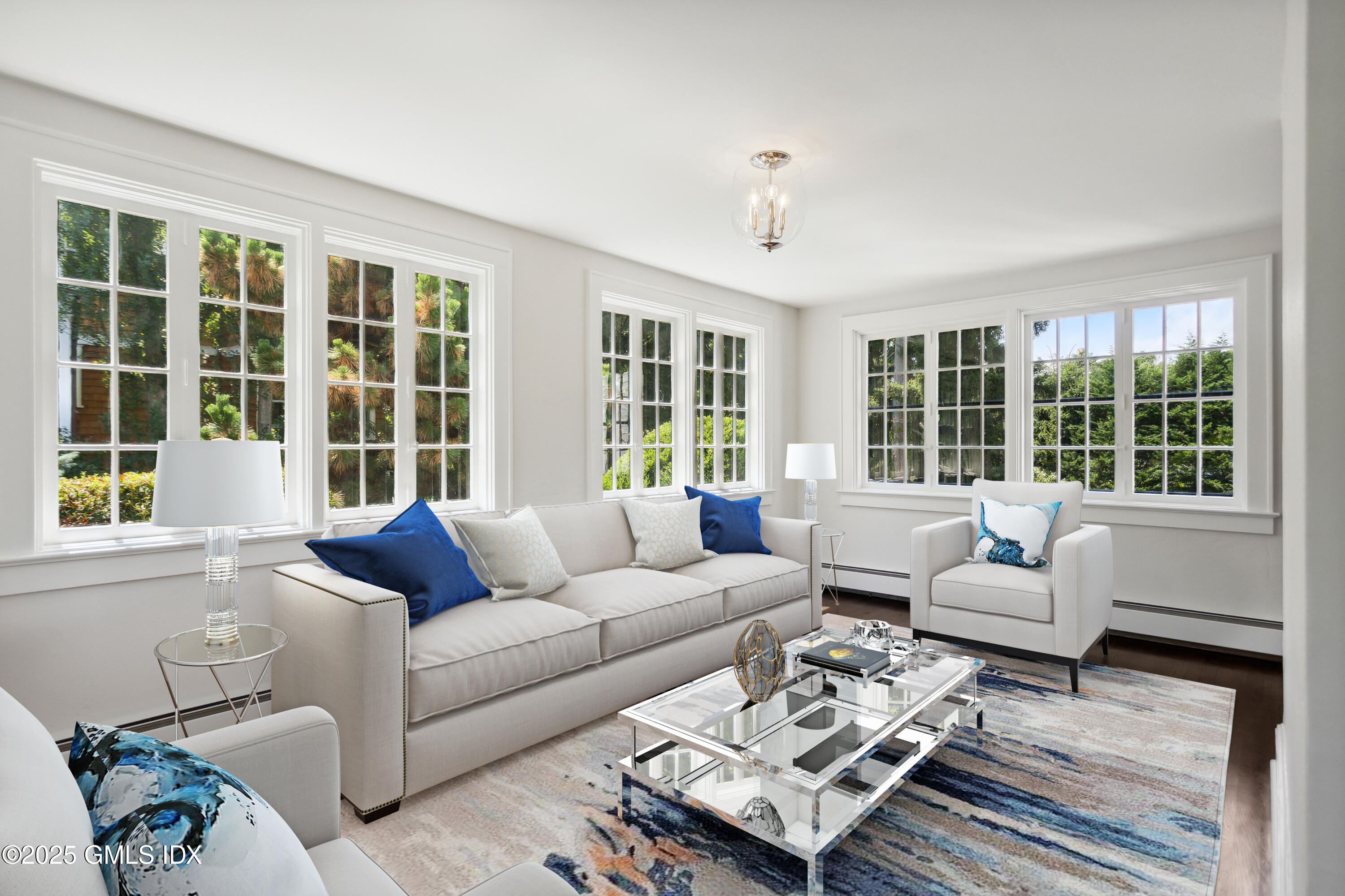 106 Patterson Avenue Greenwich, CT 06830 - Photo 5 of 25 a living room with furniture and a large window
