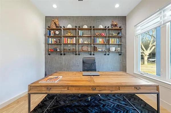 a bedroom with a bed and a book shelf