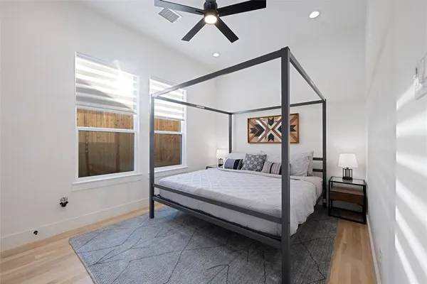 a bedroom with a bed and window