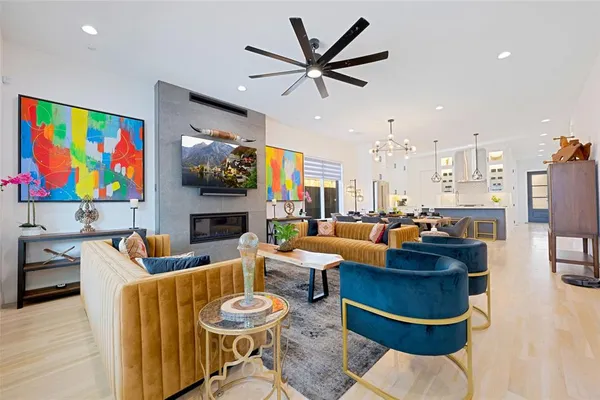 a living room with fireplace furniture and a flat screen tv
