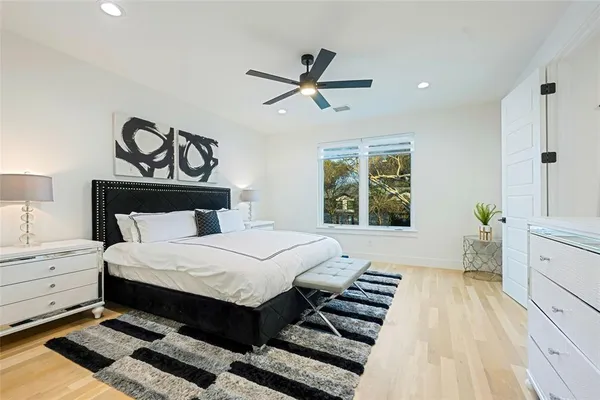 a bedroom with a bed and a window