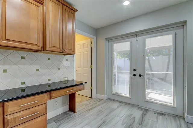 a view of room with wooden floor and cabinet