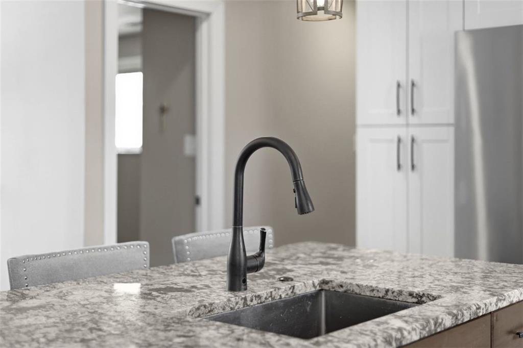161 Harmony Road Wexford, PA 15090 - Photo 12 of 34 a kitchen with a granite countertop sink and refrigerator