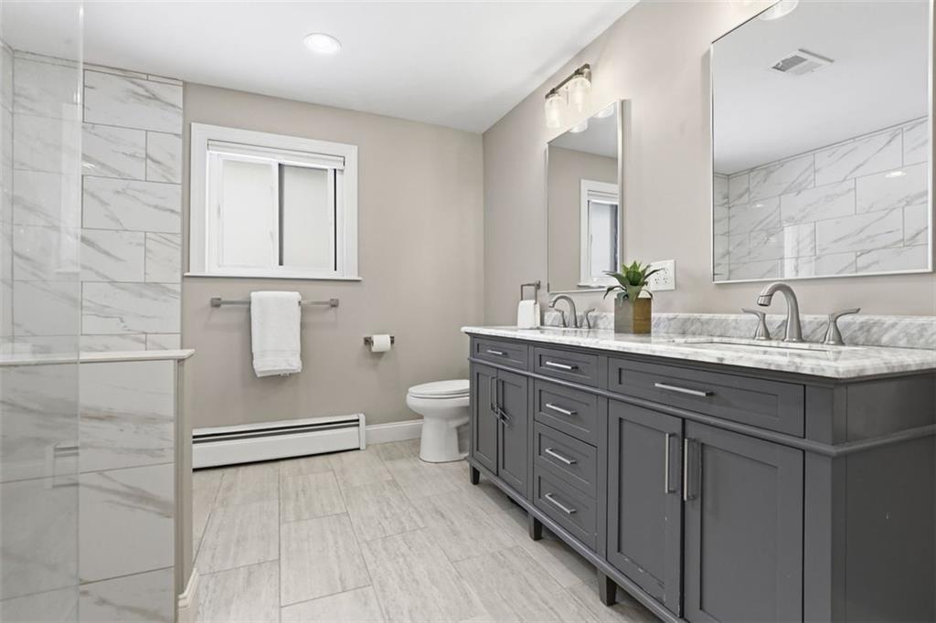 161 Harmony Road Wexford, PA 15090 - Photo 14 of 34 a bathroom with a double vanity sink mirror and toilet
