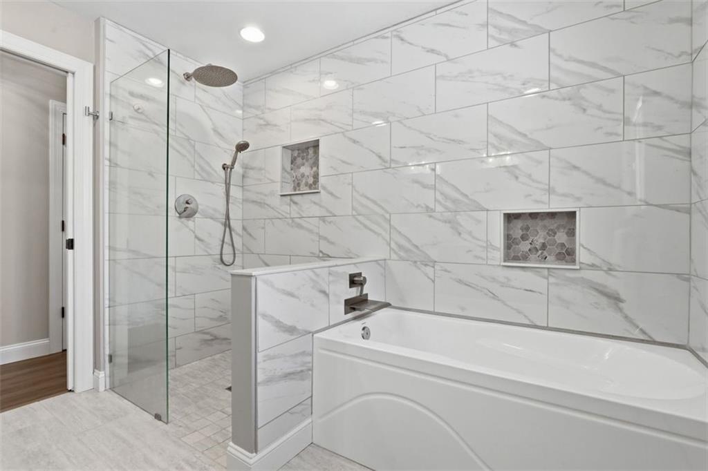 161 Harmony Road Wexford, PA 15090 - Photo 15 of 34 a bathroom with a shower and white bath tub