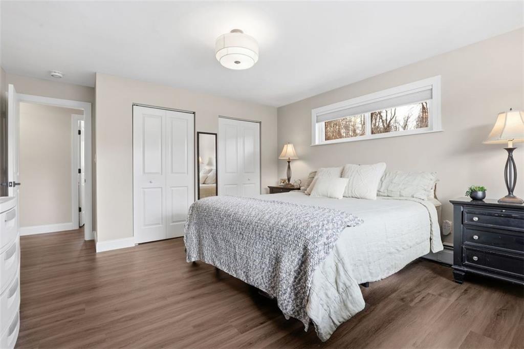 161 Harmony Road Wexford, PA 15090 - Photo 17 of 34 a bedroom with a bed and wooden floor