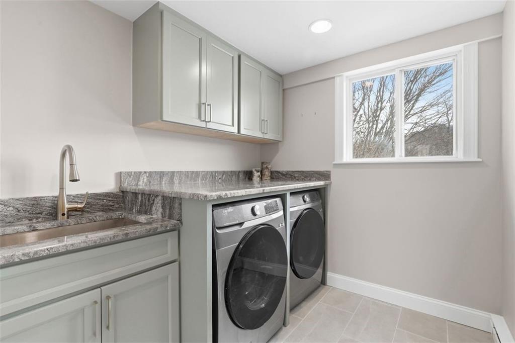 161 Harmony Road Wexford, PA 15090 - Photo 22 of 34 a utility room with sink dryer and washer