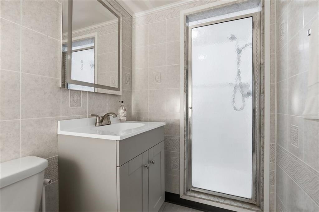 161 Harmony Road Wexford, PA 15090 - Photo 29 of 34 a bathroom with a sink a toilet and shower