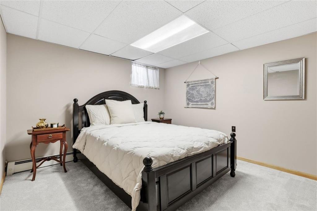 161 Harmony Road Wexford, PA 15090 - Photo 30 of 34 a bedroom with a bed and a lamp on table