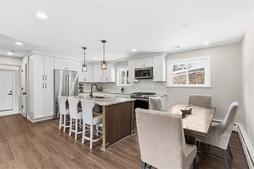 161 Harmony Road Wexford, PA 15090 - Photo 7 of 34 a view of a dining room with furniture and wooden floor
