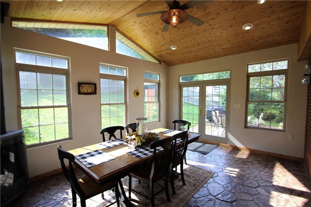 226 Waynesburg Road Washington, PA 15301 - Photo 2 of 24 Stunning 16x13 Sun Room w/ Cathedral Wood Ceilings, Recessed Lighting, Ceiling Fan Light, Gorgeous Stamped Concrete Flooring, Ornate Windows & Gas Fireplace! Double French Glass Doors lead onto Side Patio overlooking Mostly Private Fenced Back Yard!
