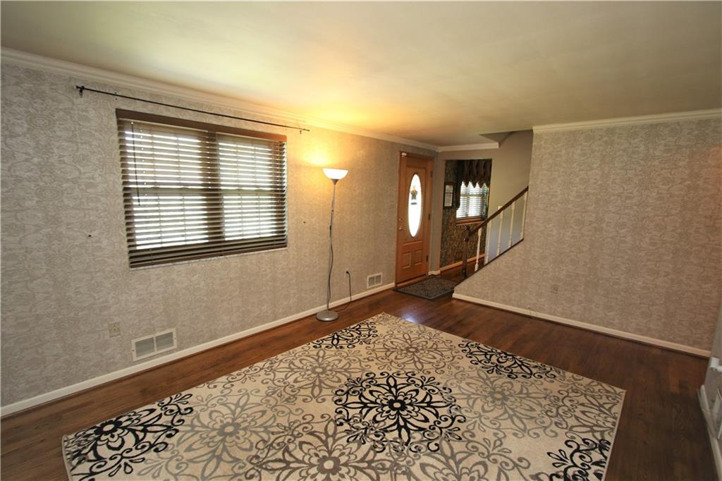 226 Waynesburg Road Washington, PA 15301 - Photo 5 of 24 Large 16x14 Living Room w/ Gleaming Original Hardwood Floors & Oval Lead Glass Wood Front Door
