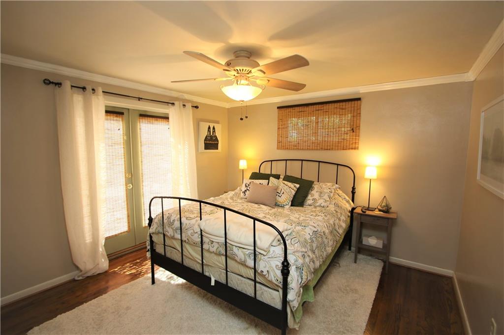 226 Waynesburg Road Washington, PA 15301 - Photo 8 of 24 Convenient 1st Floor 12x11 Master Bedroom offering Glass French Doors to Patio. Gorgeous Hardwood Floors & Ceiling Fan Light. Quality Plaster Walls accented w/ Crown Molding & Baseboard Trim.