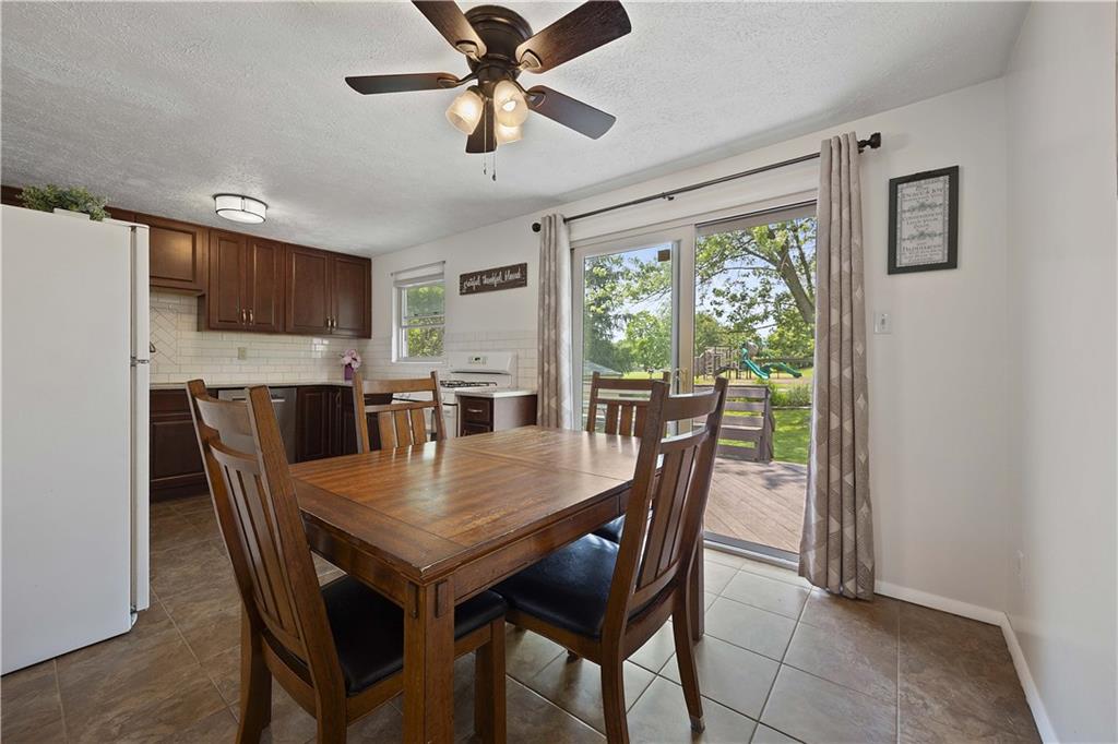119 Summit Ridge Drive Bridgeville, PA 15017 - Photo 12 of 30 Dining space opens to back sliding glass door to a welcoming deck