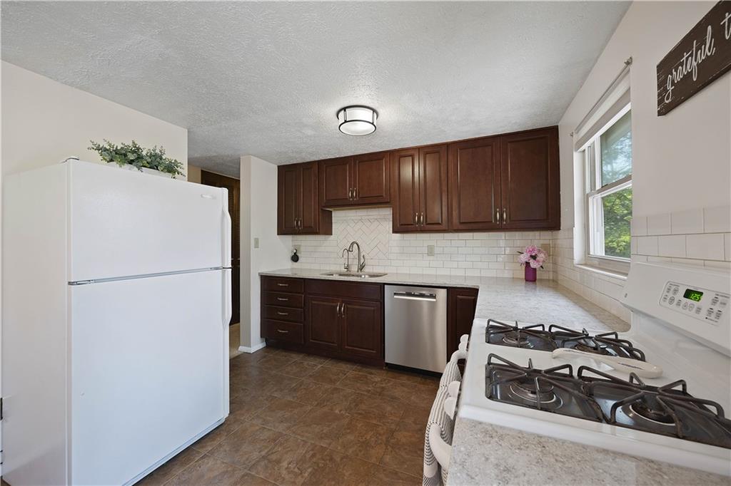 119 Summit Ridge Drive Bridgeville, PA 15017 - Photo 10 of 30 Open kitchen to dining area