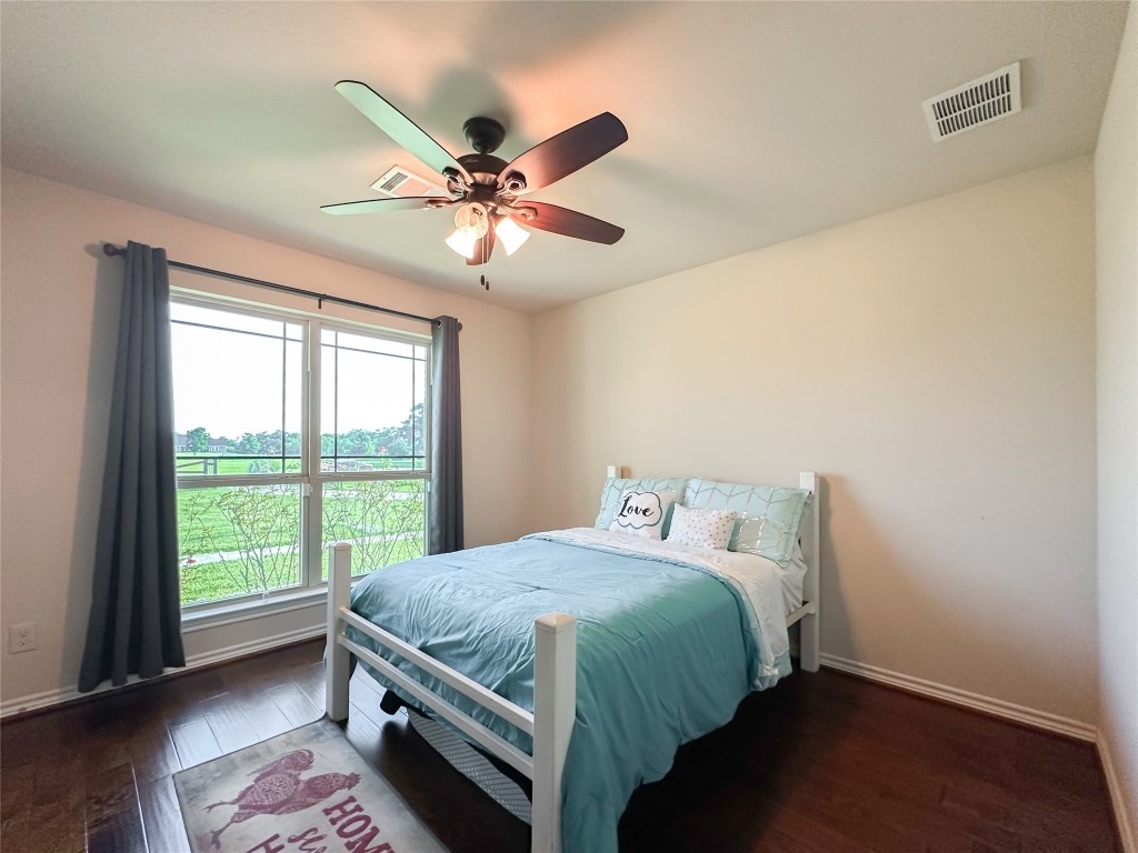 2818 Rustic Wood Lane Rosharon, TX 77583 - Photo 27 of 45 a bedroom with a bed and a window