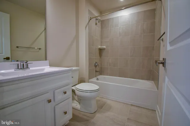 a bathroom with a sink a toilet and a bathtub