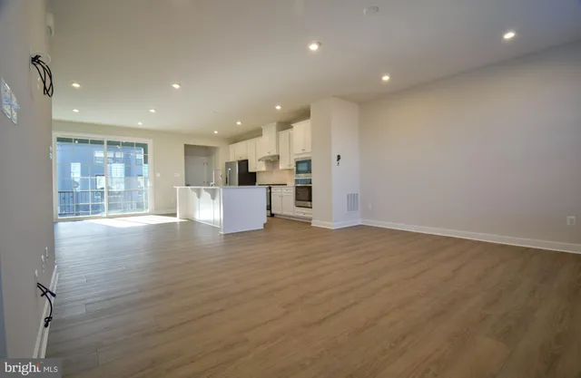 a view of kitchen and wooden floor