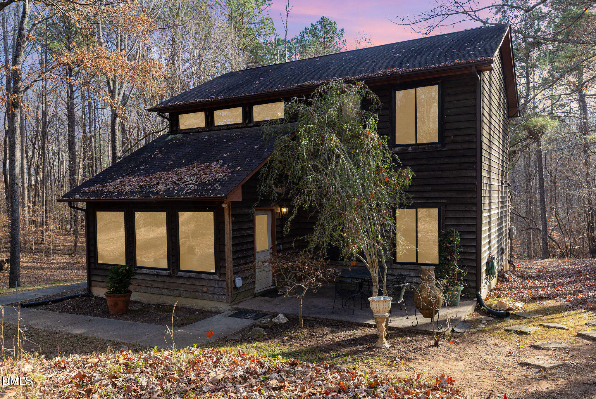 8516 Dunlee Falls Road Raleigh, NC 27613 - Photo 1 of 21 a front view of a house with garden