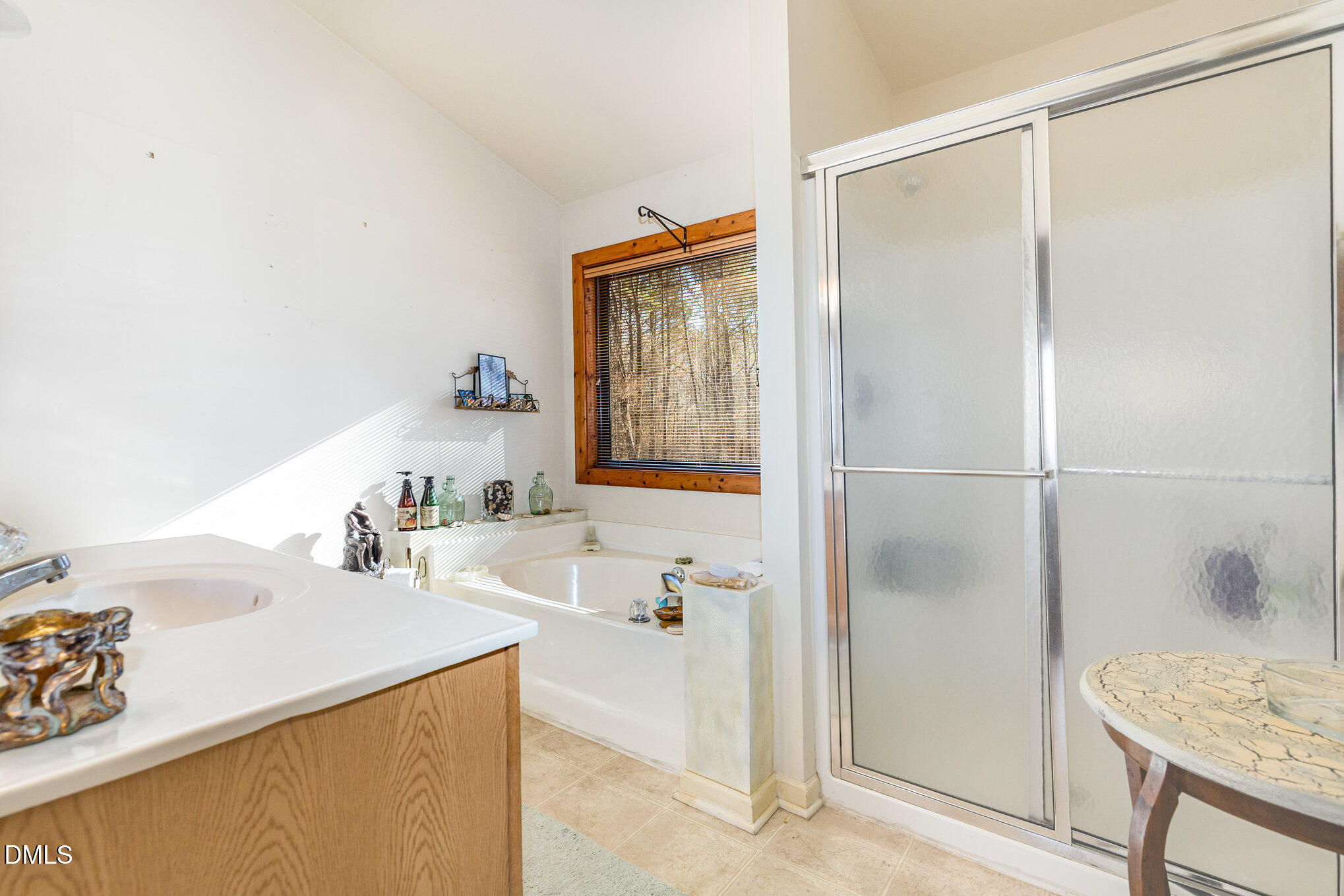 8516 Dunlee Falls Road Raleigh, NC 27613 - Photo 17 of 21 a bathroom with a sink and a mirror