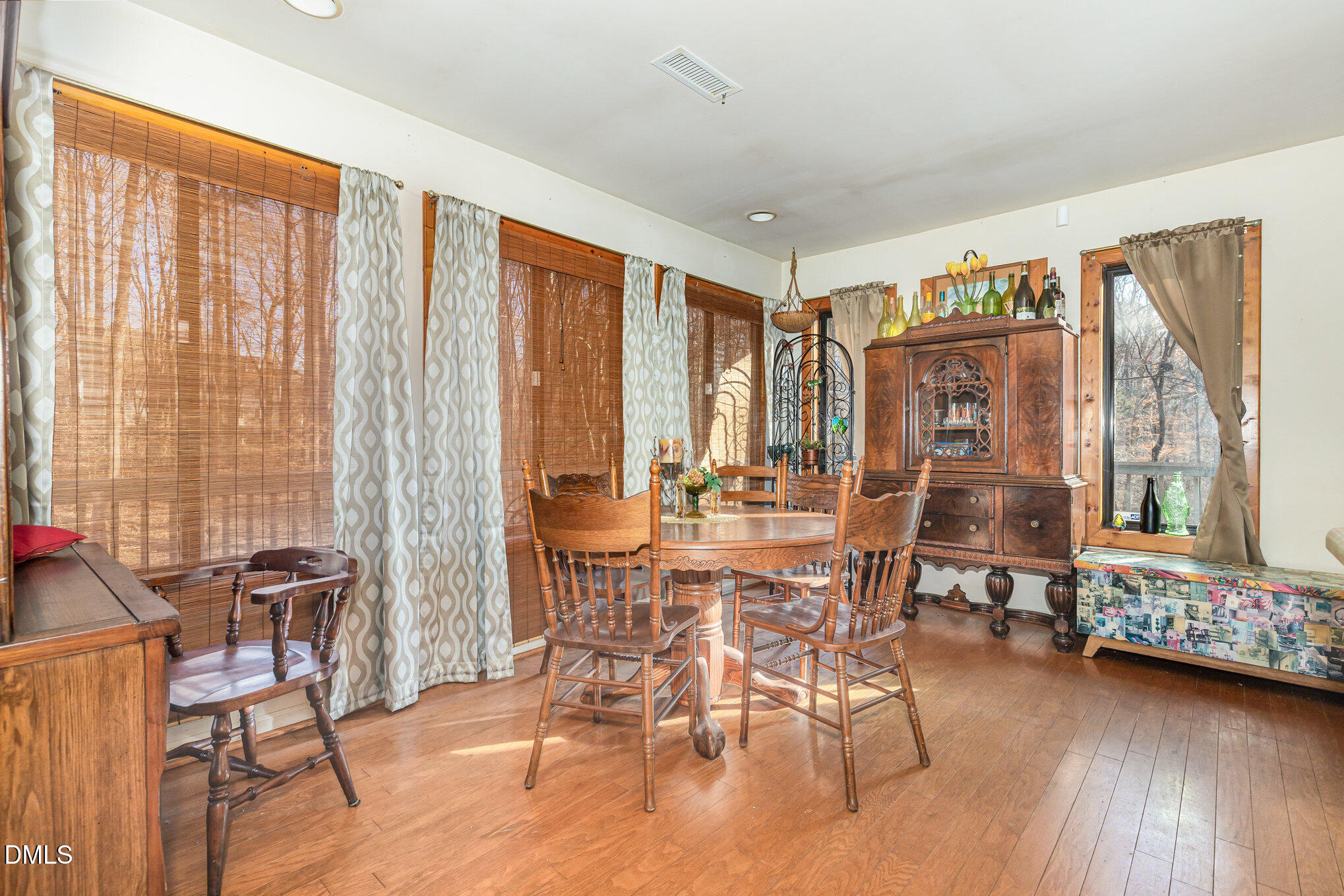 8516 Dunlee Falls Road Raleigh, NC 27613 - Photo 5 of 21 a view of a livingroom with furniture and large windows