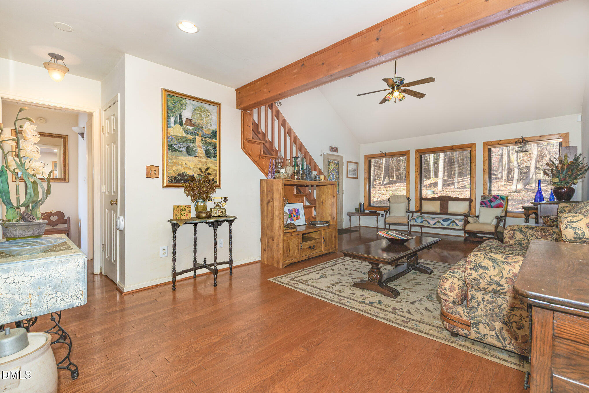 8516 Dunlee Falls Road Raleigh, NC 27613 - Photo 7 of 21 a living room with furniture and a wooden floor