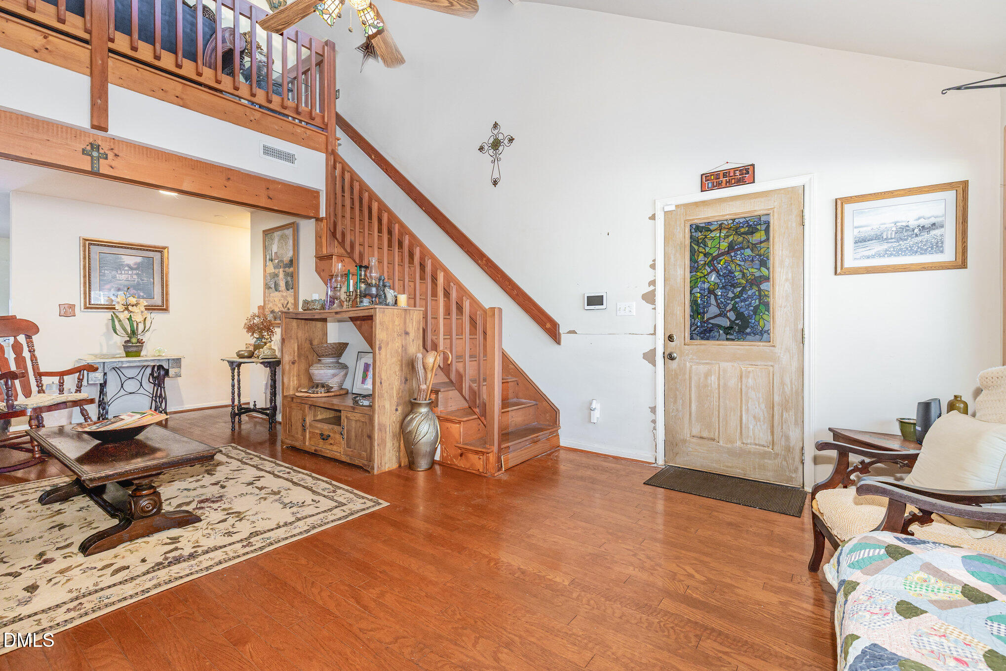 8516 Dunlee Falls Road Raleigh, NC 27613 - Photo 8 of 21 a view of a livingroom with wooden floor and furniture