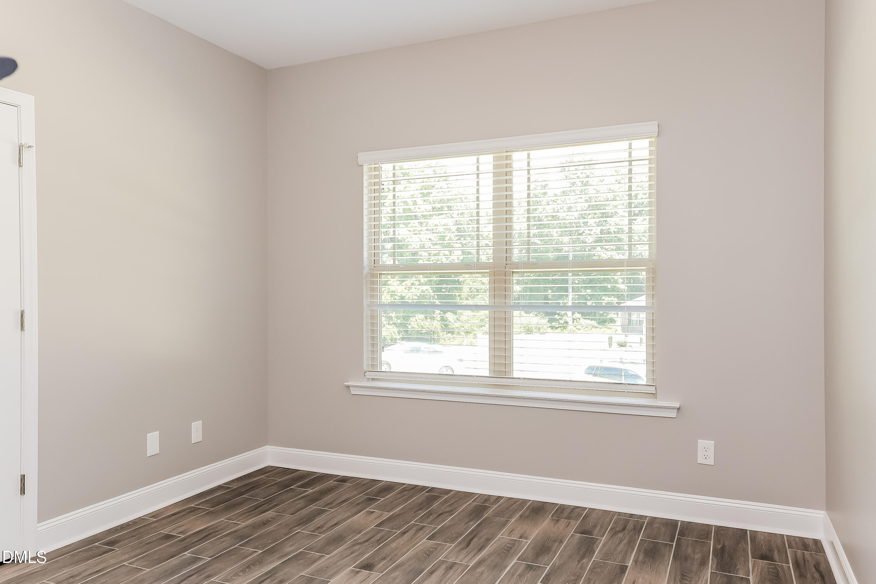 96 Longo Lane Benson, NC 27504 - Photo 11 of 16 a view of a room with wooden floor and window