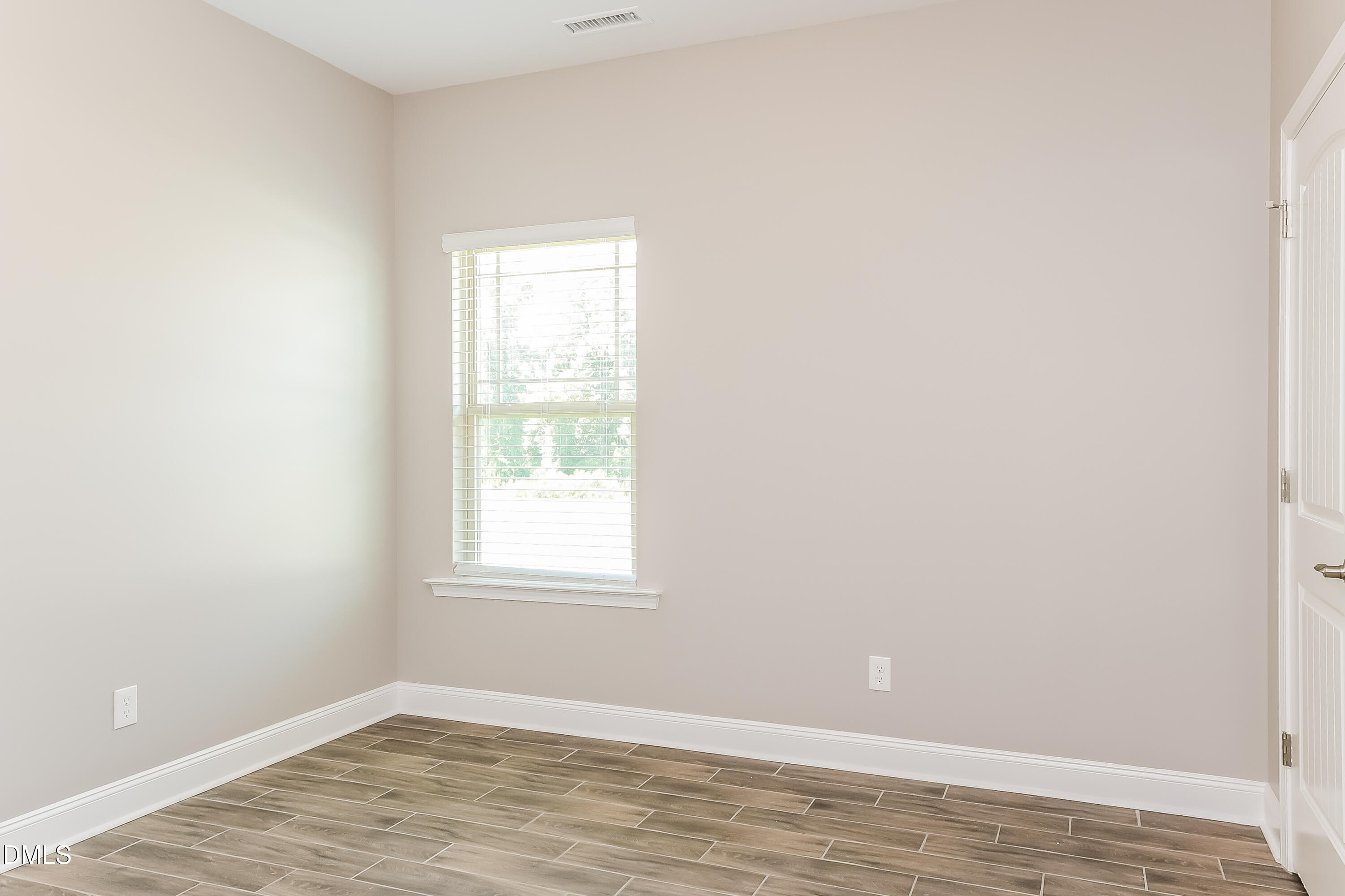 96 Longo Lane Benson, NC 27504 - Photo 12 of 16 an empty room with a window