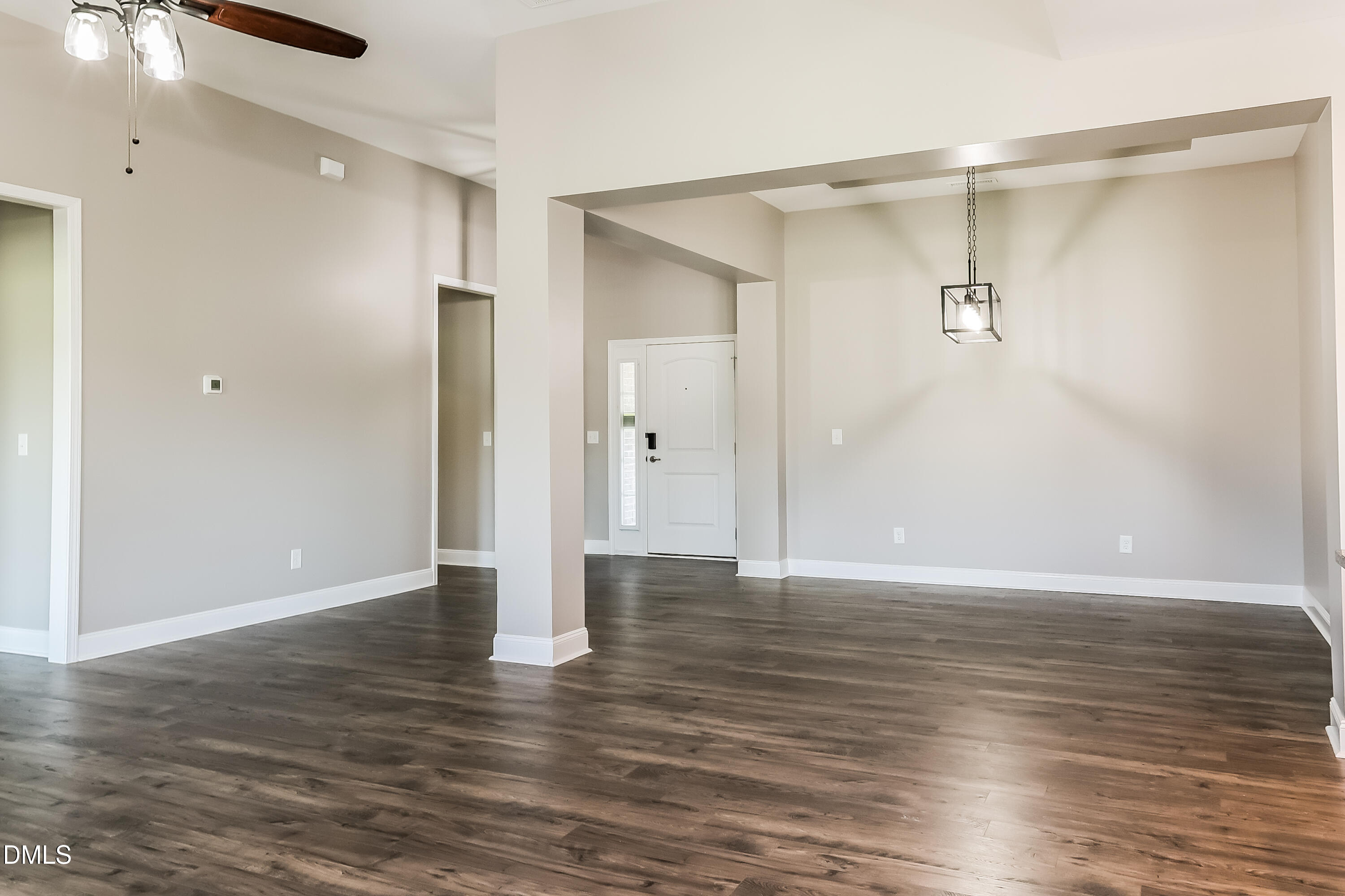 96 Longo Lane Benson, NC 27504 - Photo 5 of 16 a view of an empty room with wooden floor