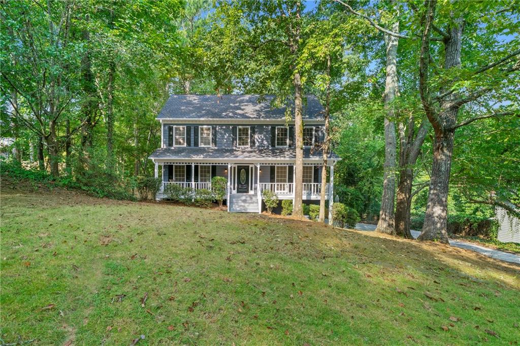386 John Tate Road Acworth, GA 30102 - Photo 1 of 1 a front view of a house with a garden