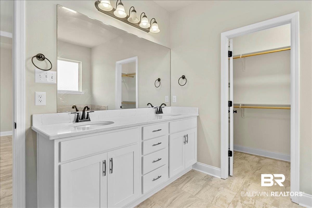 1112 Stella Road Foley, AL 36535 - Photo 14 of 33 Full bathroom featuring double vanity and a spacious closet