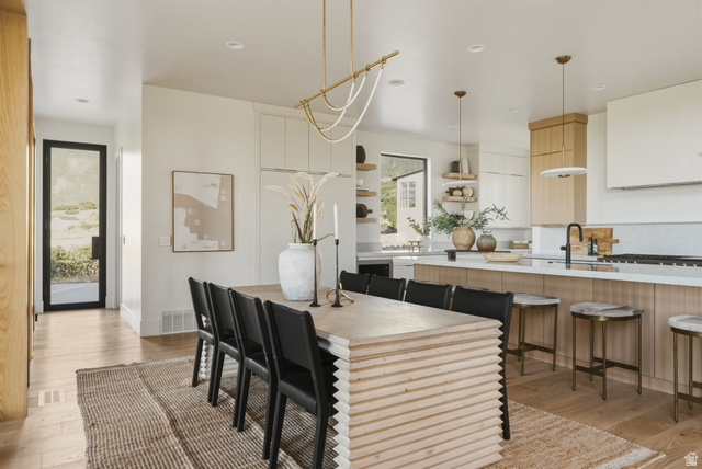 923 North Emery Lane Elk Ridge, UT 84651 - Photo 23 of 101 Open-concept dining and kitchen area with light wood-finish flooring