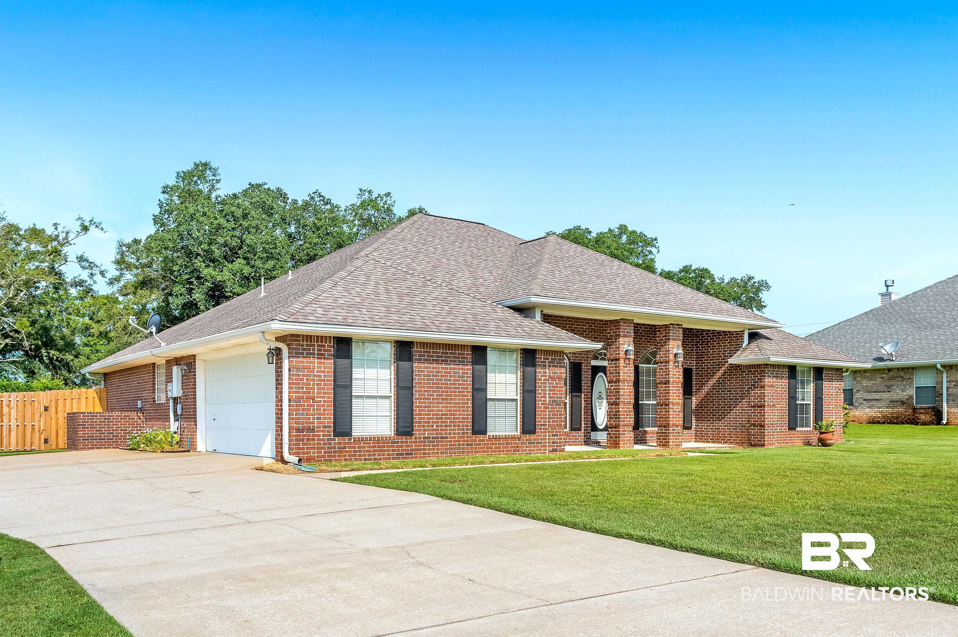 12443 Venice Boulevard Foley, AL 36535 - Photo 2 of 59 Ranch-style home featuring a front lawn and a garage