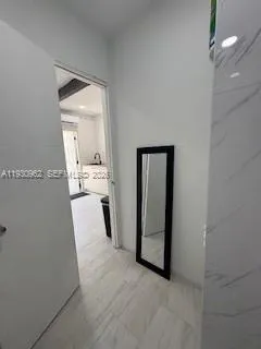 a view of a storage & utility room with a sink