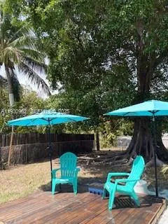 a view of a chair and table in the patio