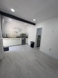 a view of an empty room with a fireplace