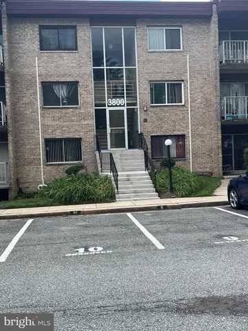 a front view of a house with a yard and a garage