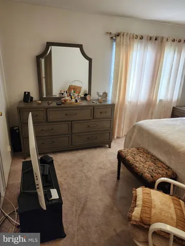a kitchen with a sink a refrigerator and cabinets