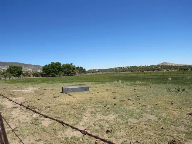 a view of lake with green space