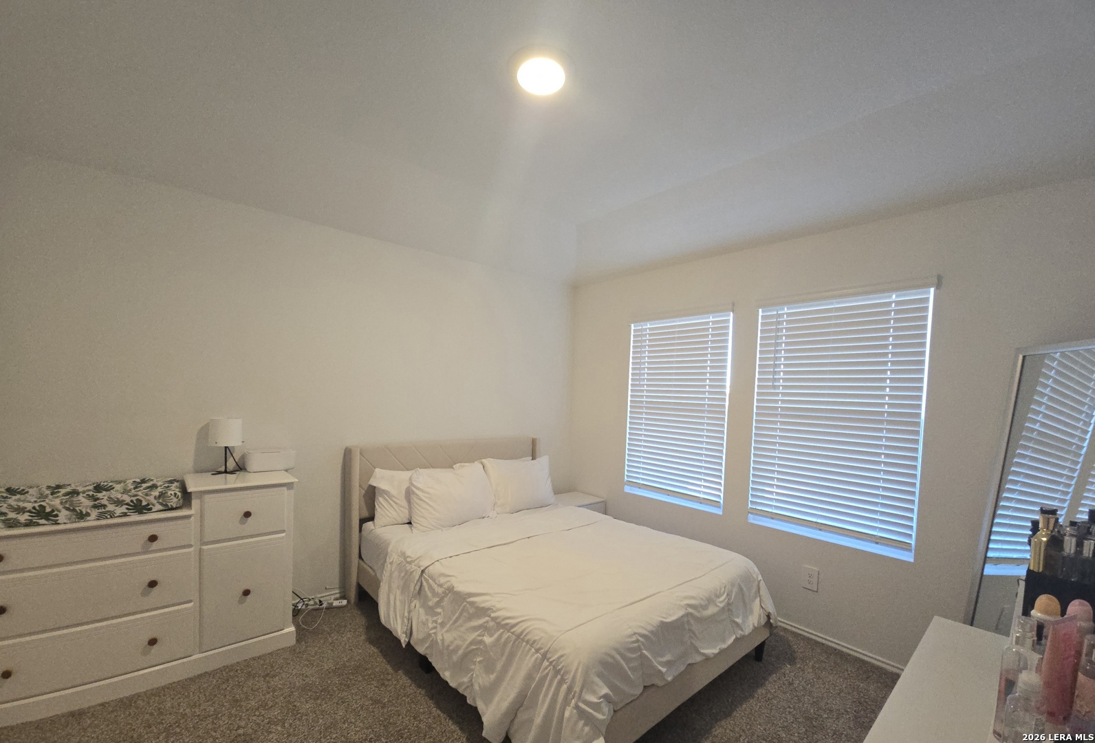 328 Celosia Loop Kyle, TX 78640 - Photo 11 of 29 a bedroom with a bed and window