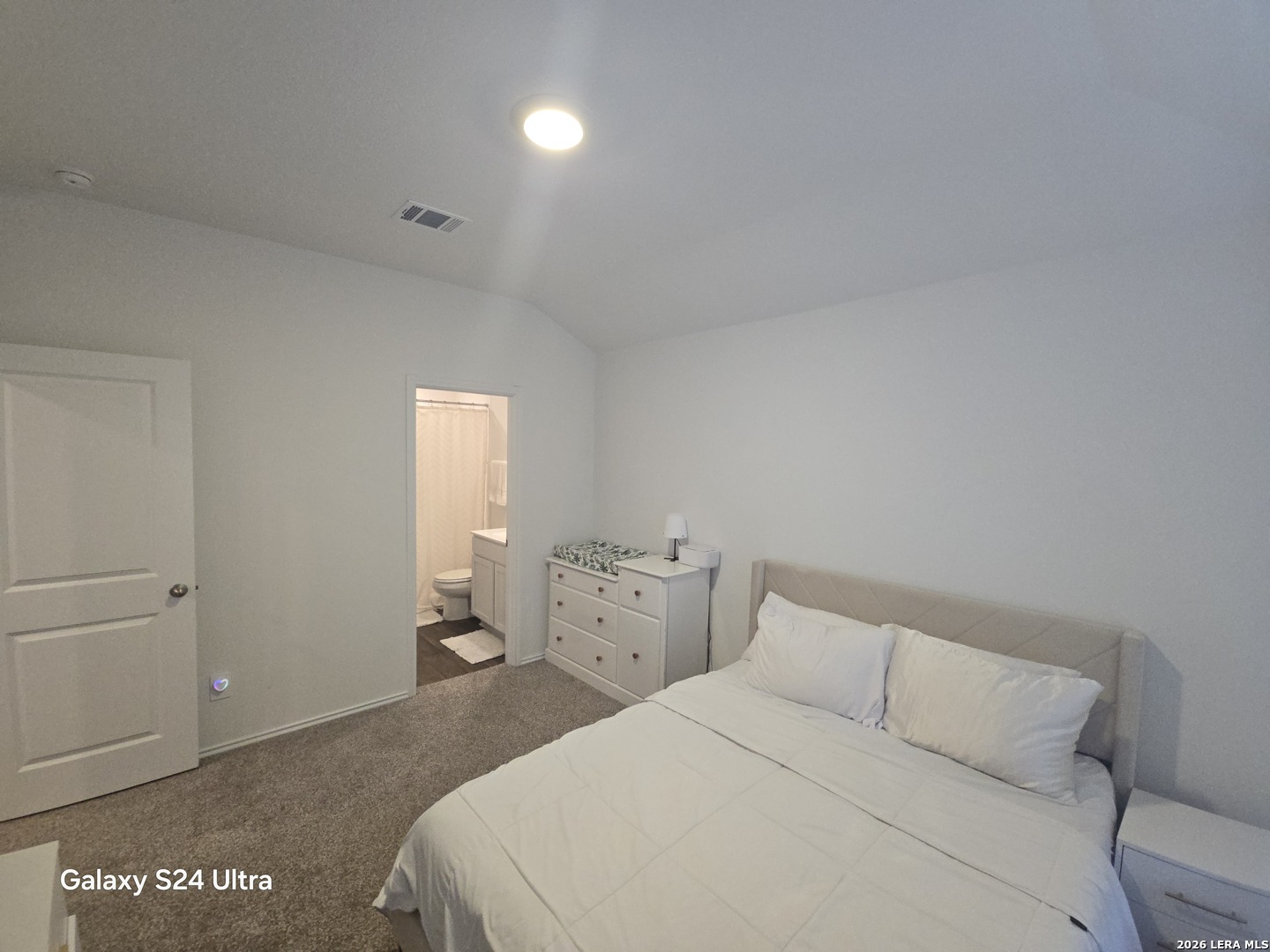 328 Celosia Loop Kyle, TX 78640 - Photo 13 of 29 a bedroom with a bed and utility room