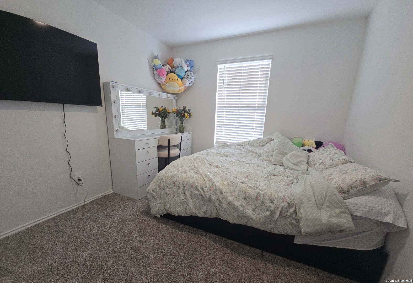 328 Celosia Loop Kyle, TX 78640 - Photo 17 of 29 a bed sitting in a bedroom next to a window