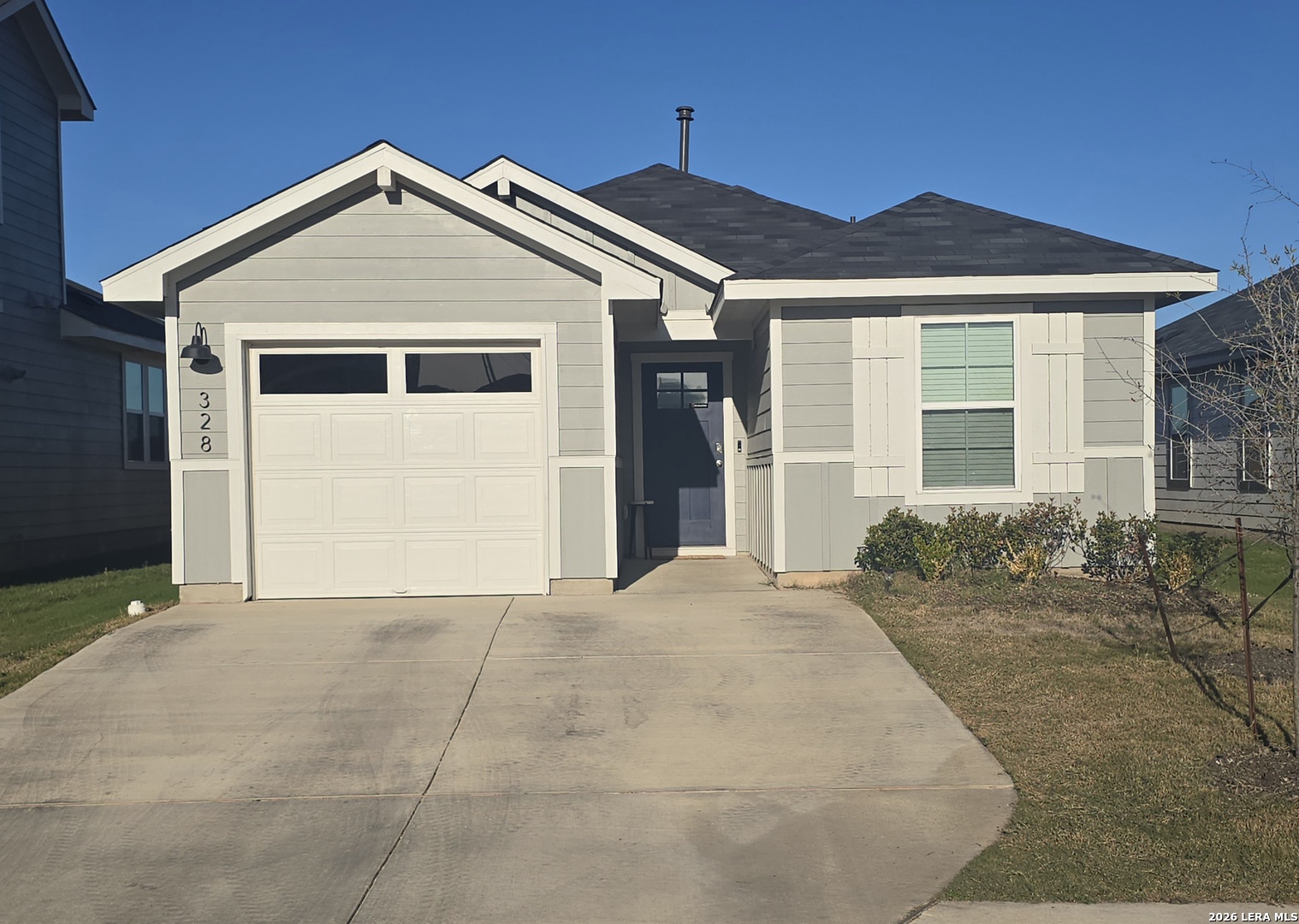 328 Celosia Loop Kyle, TX 78640 - Photo 28 of 29 a front view of a house with a yard