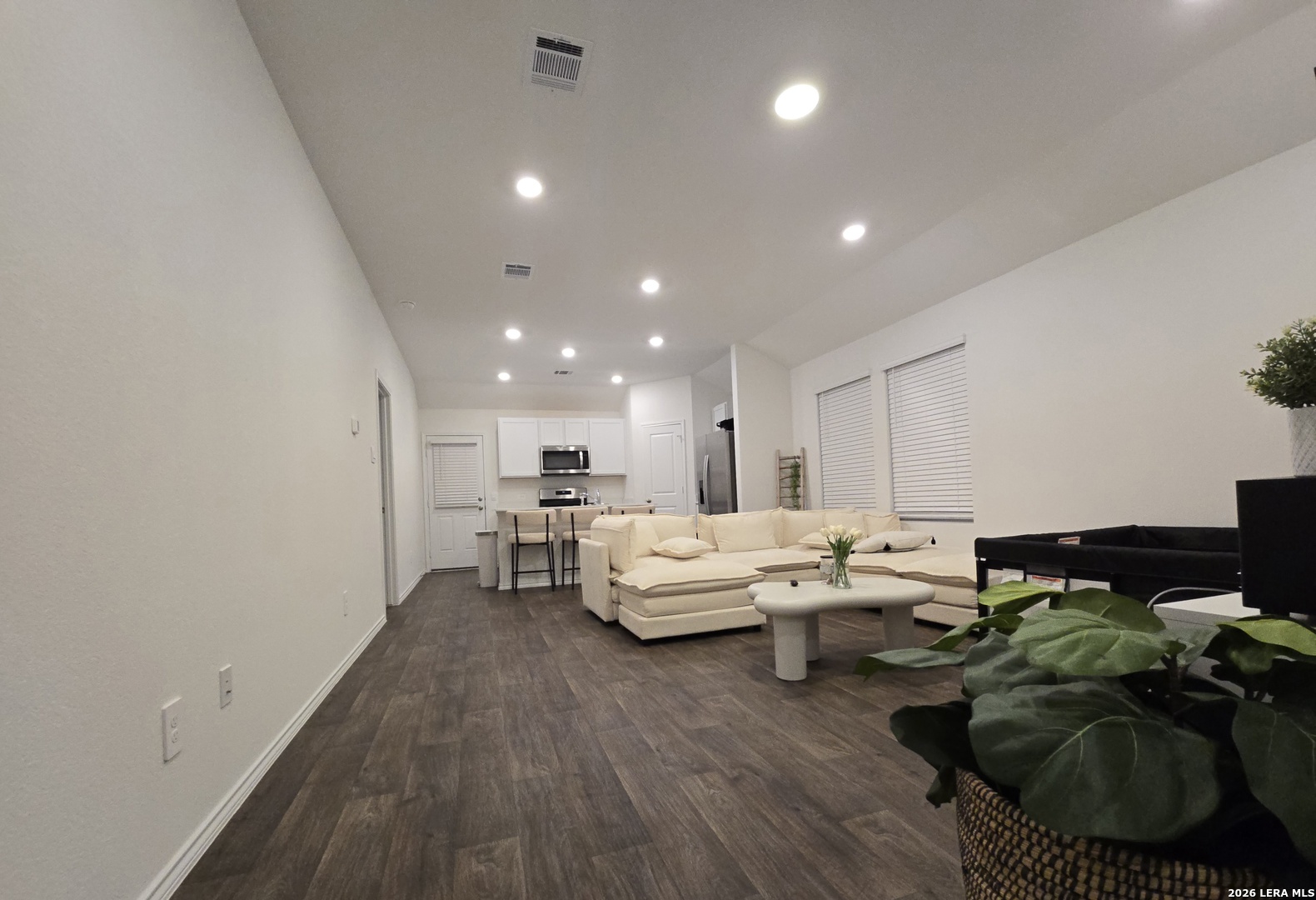 328 Celosia Loop Kyle, TX 78640 - Photo 5 of 29 a living room with lots of furniture and hard wood flooring