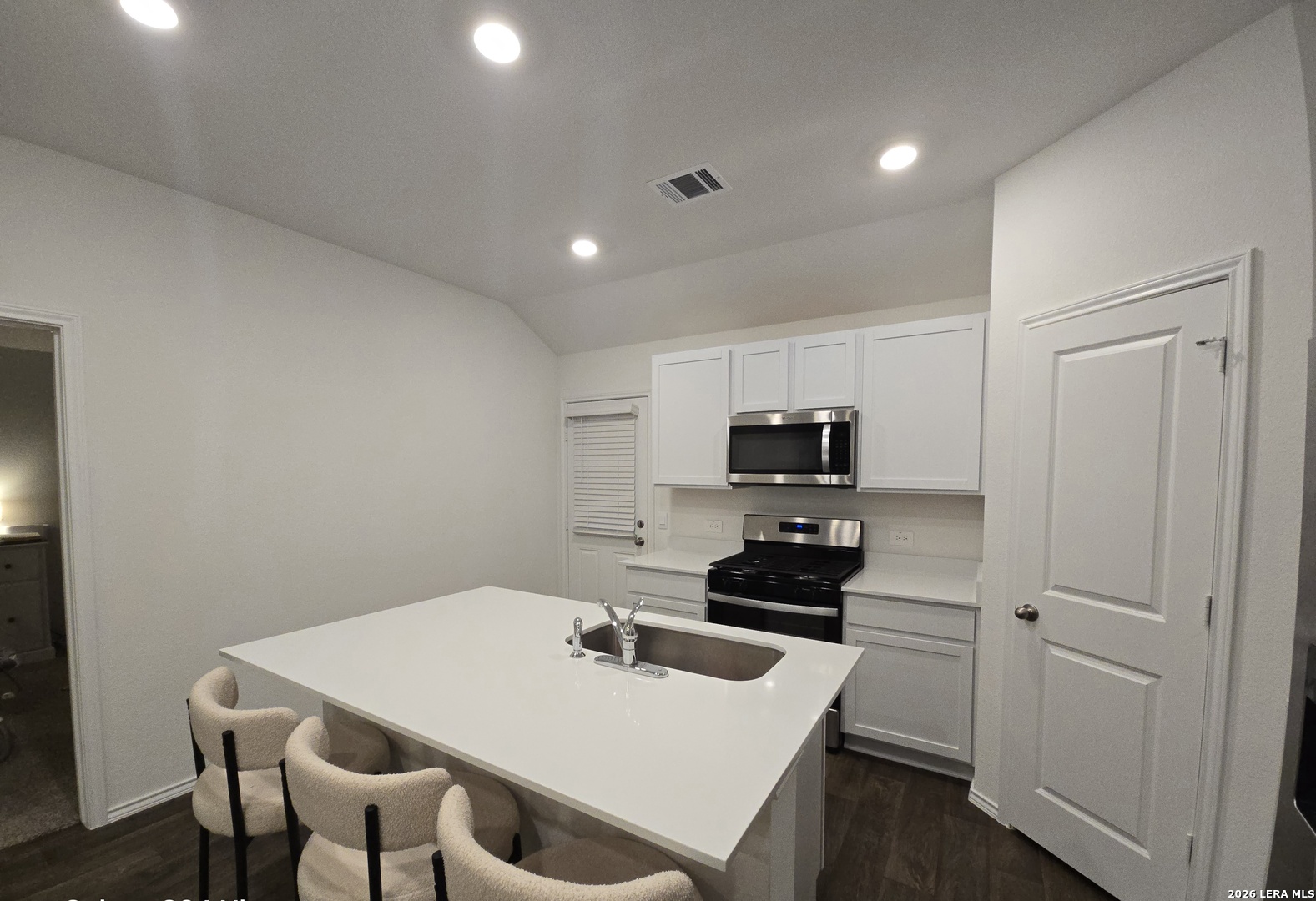 328 Celosia Loop Kyle, TX 78640 - Photo 9 of 29 a kitchen that has a sink and a stove in it