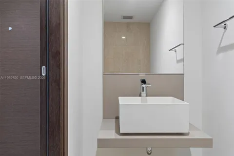 a view of a balcony with chair and wooden floor