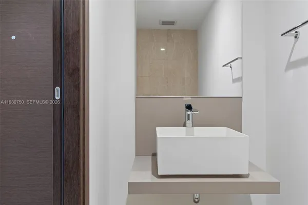 a view of a balcony with chair and wooden floor